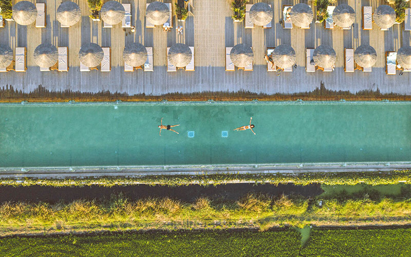 quinta comporta wellness boutique resort pool sunbeds