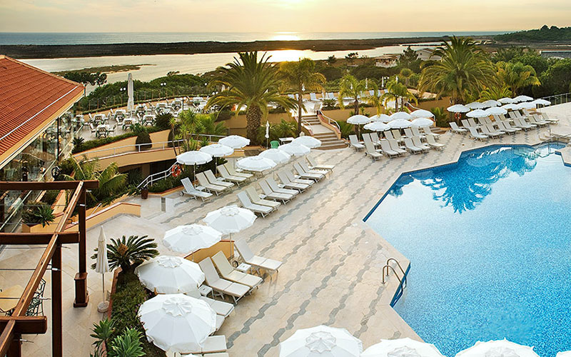 hotel quinta lago pool sunset algarve