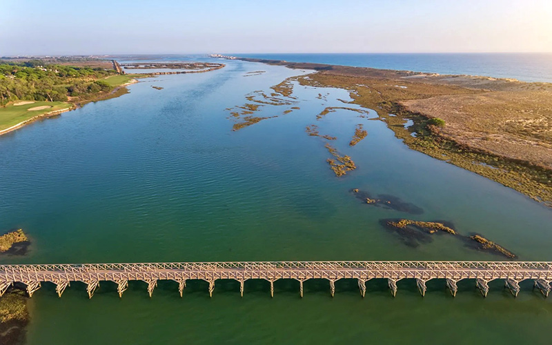 hotel quinta lago wooden bridge ria formosa lagoon
